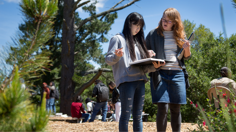 Student and teacher learning outdoors